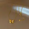 Collar con colgante de lazo chapado en oro con circonita para mujer, cadena para suéter de lujo ligero vintage de nicho, accesorio exquisito y versátil