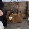 Bolsa de camurça da moda para mulheres 2026 novo modelo bolsa tote de grande capacidade bolsa de ombro com estampa de leopardo bolsa tote versátil para o dia a dia