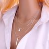 Collar multicapa europeo y americano de venta caliente en Internet, nuevo collar de accesorios simples de nicho de tira metálica con lentejuelas y cadena de cuentas de cobre para mujer