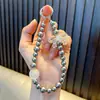 Cadena para llavero de teléfono móvil de perla, temblorosa, en vivo, cadena para llavero de teléfono móvil perlada, colgante, pequeño regalo, pulsera, venta al por mayor