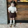 Conjunto de Verano Estilo Coreano para Niñas 26 Nuevo Estilo Academia Niña Pequeña Camisa de Manga Corta Plisada Cuello de Muñeca Pantalones Cortos de Encaje