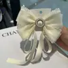 2025 Nuevo Estilo Encaje Pedrería Moño Estilo Coreano Pinza de Resorte para la Parte Posterior de la Cabeza de Mujer Accesorios para el Cabello Versátiles de Princesa Venta al por Mayor