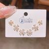 Verano nuevo chapado en oro real exquisitos tres pares de aretes pequeños de alto sentido pequeños frescos dulces aretes de temperamento combinables