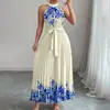 Moda Femenina Transfronteriza Europea y Americana Verano 2026 Elegante Cuello Halter Cintura de Corbata Estampado Floral Plisado Vestido Largo con Dobladillo Amplio