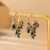 Populares aretes de corazón con circonita azul oscuro en forma de gota de agua, de alta gama, a la moda, exquisitos, elegantes, con flecos que crean un efecto adelgazante