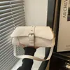 Bolso pequeño texturizado de alta calidad al por mayor para mujer, nuevo modelo de verano 2026, bolso de hombro con retazos de color liso, bolso de axila para el día a día