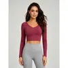 Top de yoga personalizado com costas cruzadas, mangas compridas e bojo integrado, feito de spandex Xiaoxing de alta elasticidade, adequado para Pilates e fitness, estilo feminino