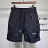 Shorts Masculino Estilo Japonês Verão 2025 Soltos Casuais Esportivos Secagem Rápida Finos Cor Sólida Versátil Simples Comprimento do Joelho Shorts