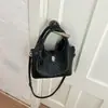 Bolso de mano vintage texturizado de nicho, bolso tote pequeño para mujer, nuevo modelo 2026, bolso tipo cubo simple, bolso de bandolera de moda