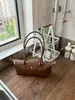 Venta al por mayor transfronteriza de bolsos pequeños para mujer, nuevos bolsos de axila con diseño de nicho vintage, bolsos de mano de moda para salir, bolsos de hombro modernos