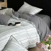 Juego de ropa de cama de cuatro piezas de algodón puro cepillado Clase A, ropa de cama de algodón de alta gama, funda de edredón gruesa, juego de tres piezas para estudiantes, sábana plana y sábana bajera