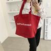 Bolso de hombro de lona con estampado de letras, estilo coreano, de gran capacidad, para estudiantes, de tela, sencillo, para viaje, primavera y verano de 2022