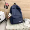 Mochila escolar de color sólido de alto valor, gran capacidad, ligera, mochila escolar simple, versátil, de doble hombro, mochila casual