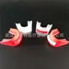 Venta caliente protector bucal de doble cara aparatos deportivos protector bucal de boxeo aparatos protectores de taekwondo bolsa opp