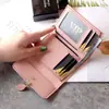 Nueva cartera pequeña femenina corta estudiante moda coreana pequeña fresca hoja tres pliegues hebilla monedero tarjetero mayoreo