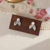 Exquisitos pendientes de perlas de alta gama para mujer, moda de lujo ligero, adecuados para ir al trabajo, elegantes pendientes de mariposa, accesorios versátiles