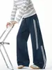 Pantalones casuales de corte diagonal a bloques de color con doble raya estilo americano para hombre, pantalones de trabajo de pierna recta diseño de otoño, pantalones vintage de pierna curva