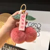 Sakura para TiPiel genuina de conejo rex pequeño colgante de llavero de coche de cereza bola de felpa decoración de bolsa al por mayor