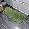 Alfombrilla de baño estilo ins transfronteriza con plantas verdes, alfombrilla de inodoro absorbente de agua, felpudo de forma irregular para uso doméstico, alfombra de tierra de diatomeas