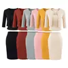 Conjunto de Verano 2026 Estilo Nuevo para Mujer Estilo Chica Caliente Cárdigan de Color Sólido Camiseta con Almohadillas en el Pecho + Falda de Cintura Alta