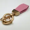 Colgante llavero de piel de oveja francesa Estilo Nuevo Cuero fresco creativo exquisito marca de moda llavero corto para coche