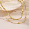 Collar apilable de acero de titanio con baño de PVD que no se decolora, diseño de hueso de serpiente con cuentas doradas, joyería versátil de cadena para clavícula al por mayor para mercados europeos y americanos transfronterizos