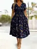 Vestido Feminino Europeu e Americano de Verão 2026 Novo com Gola V Estampado Slim Fit Elegante de Manga Curta