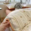 Nuevo juego de ropa de cama de cuatro piezas de gasa arrugada tejida con color y gasa abullonada para dormitorios de estudiantes, juego de tres piezas para una persona, amigable con la piel, adecuado para todas las estaciones
