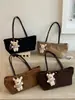 Bolso tote minimalista de nicho estilo coreano 2026 nuevo modelo bolsa de gran capacidad para debajo del brazo bolso de hombro de color liso retro de nicho para commuting