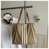 Bolso tote de lona de gran capacidad estilo casual coreano 2026 para mujer, nuevo bolso de mano de moda para estudiantes, adecuado para la escuela y el trabajo