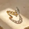 Nuevo anillo europeo y americano de acero inoxidable, chapado al vacío en oro de 18 quilates, diseño bicolor, joyería de acero de titanio de alta gama estilo INS