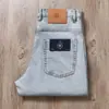 Jeans Masculino Retrô Lavado Azul Claro de Algodão Stretch Novo Estilo Verão 2026 Cintura Média-Alta Corte Reto Solto