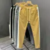 Nueva colección de primavera y otoño: pantalones casuales a rayas de bloques de color para hombre, modernos y elegantes, de pierna recta de alta gama, corte ajustado y deportivos largos