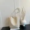 Bolsa grande de textura tecida feminina 2026 outono inicial nova sensação solta bolsa tote moderna cor sólida bolsa de ombro única estilosa