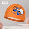 Nova touca de natação infantil com revestimento de PU touca de natação à prova d'água não apertada cabeça meninos e meninas touca de natação de desenho animado fábrica atacado