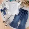 2026 Nuevo Conjunto de Estilo Academia para Niñas de Comercio Exterior Transfronterizo Top Blanco de Mezclilla con Lazo Manga Corta + Pantalones Largos