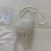 Bolso Tejido Hueco Único para Mujer 2026 Nuevo Bolso de Paja Casual para Vacaciones con Cordón, Borlas y Cuentas, Bolso Cubo de un Solo Hombro