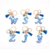 Llavero Colgante Temático Océano Azul con Borla de Estrella de Mar, Llavero de Resina Encanto para Bolso con 26 Letras