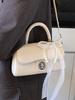 Bolsa cuadrada pequeña portátil de estilo coreano de alta gama, temperamento simple, nueva para primavera y verano, moda casual, todo-partido, bandolera de PU para mujer