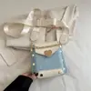 La popular bolsa para teléfono móvil de este año 2025 nueva niche de alta gama de moda versátil bandolera estilo extranjero hombro bolsa cuadrada pequeña
