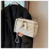 Bolso de cadena con patrón de rombos para mujer, nuevo bolso de hombro cruzado de moda de nicho para el verano de 2026, bolso tipo caja de alta gama elegante