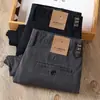 Pantalones casuales de sarga de algodón color gris oscuro para hombre, otoño e invierno 2022, nuevos, de cintura media-alta, elásticos, gruesos, rectos, holgados, para negocios