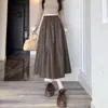 Saia Feminina de Couro PU Outono 2026 Versátil Elegante Moda Cintura Elástica Solta Comprimento Médio Linha A Saia Guarda-chuva