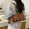 Bolsa de Bolinhas de Nicho Super Quente Feminina 2026 Novo Estilo Moda Versátil Bolsa de Ombro Bolsa de Axila Bolsa de Mão com Toque de Luxo Bolsa Baguete