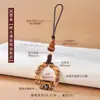 Venta al por mayor de fábrica de cordón para teléfono móvil de sándalo, funda para teléfono móvil, colgante de disco U, bolso de pareja retro, colgante de anillo con hebilla