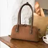 Bolsa de Mão Retrô de Nicho Feminina 2026 Nova Bolsa com Toque de Luxo Bolsa Baguete Casual Tendência Versátil Bolsa de Ombro Único de Axila