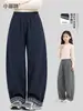 Coleção de outono 2026 para meninas Xiaofei, novo estilo, calça casual de perna curva para crianças maiores, calça xadrez da moda de perna reta com barra flare