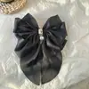 Clip de resorte con lazo de perla, accesorio para el cabello de alta gama, elegante y francés para celebridades de Internet.
