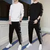 Traje de hombre primavera 2024 nuevo conjunto de suéter de cuello redondo con leggings deportivos casuales traje guapo