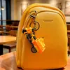 Chaveiro de triciclo clássico de fricção, brinquedo divertido para aliviar o estresse de estudantes, pequeno pingente, acessório de bolsa, pequeno presente no atacado